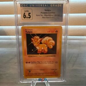 Base Set shadowless blue dot Spot error Vulpix Pokemon card CGC 6.5 Slab 68/102